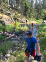 Aleta and the boys doing a creek crossing.